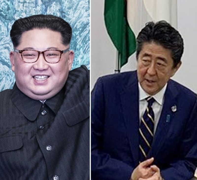日本首相安倍晉三（右）稱北韓日前最新試射的多管火箭為飛彈，北韓國營媒體今天譏安倍是個「低能兒及政治侏儒」，還放話稱安倍不久就會看到貨真價實的彈道飛彈。（檔案照）