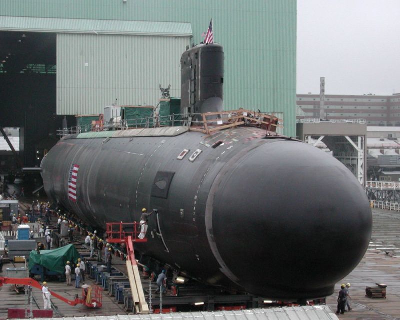 The Navy's newest and most advanced nuclear attack submarine, Virginia (SSN-774), is moved outdoors for the first time Saturday, Aug. 2, 2003, at the General Dynamics Electric Boat shipyard in Groton, Conn. The Virginia will be christened at a shipyard ceremony Saturday, Aug. 16. (AP Photo/Carol Phelps)